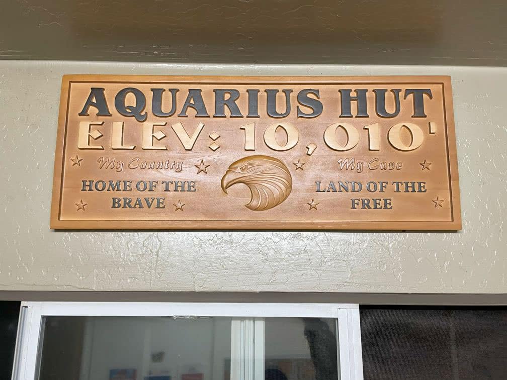 Aquarius hut sign